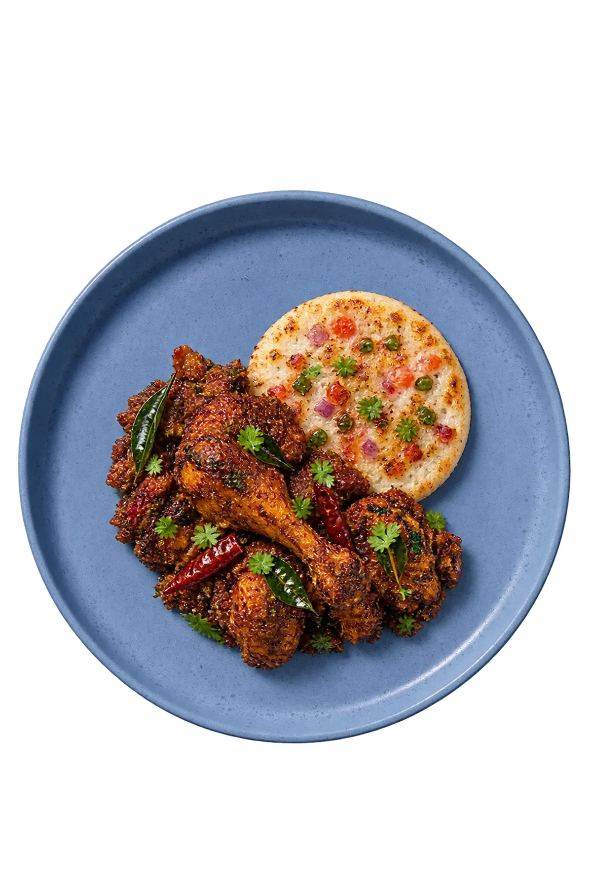 Sandy Loam Blue dinnerware serving dry Chettinad chicken with a small mini-uttapam accompaniment.