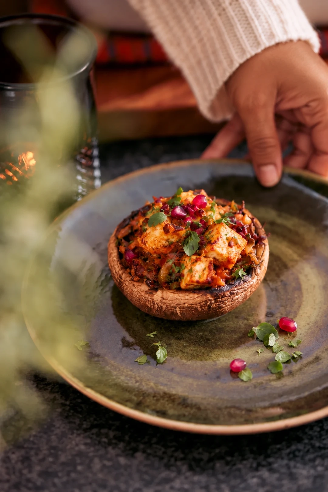 Tandoori bharwa mushroom with spiced paneer on green glazed dinnerware.